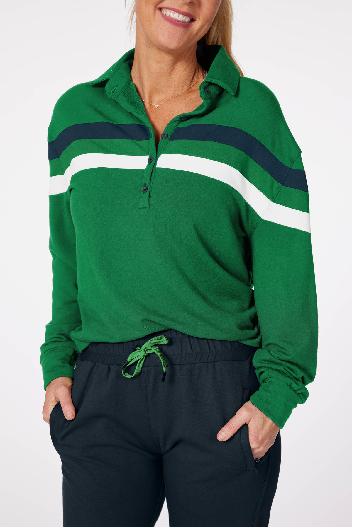 women wearing golf pullover called the Murray. green with white and teal stripes