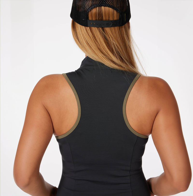 Load image into Gallery viewer, Model wearing Sleeveless Duchess women&#39;s golf dress in black.  Back view. 
