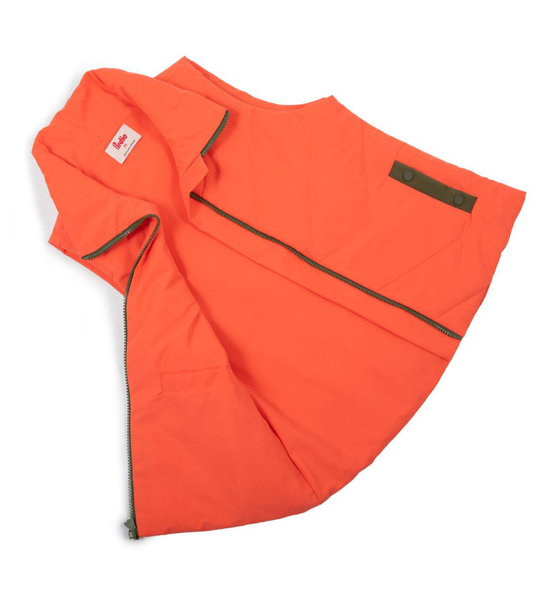 Load image into Gallery viewer, Flay lay of Coral Twilight womens golf Vest showing the inside on the left side
