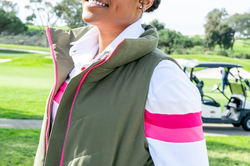 Load image into Gallery viewer, Model wearing olive green twilight womens golf vest with white murray golf shirt underneath on golf course. 
