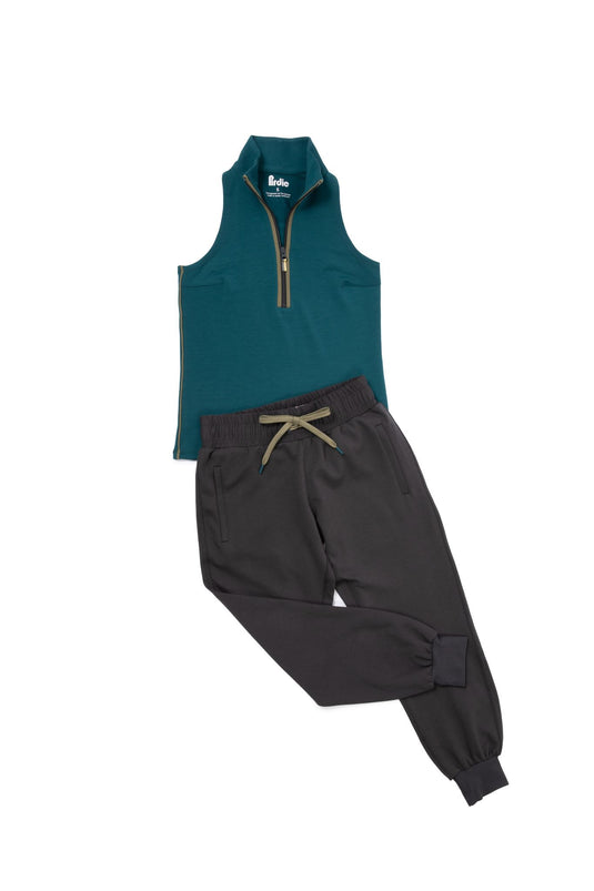 Teal back nine sleeveless golf top and black ace golf joggers.