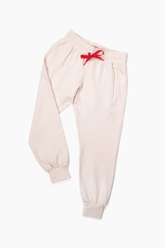 Pink ace golf joggers in a flat lay.