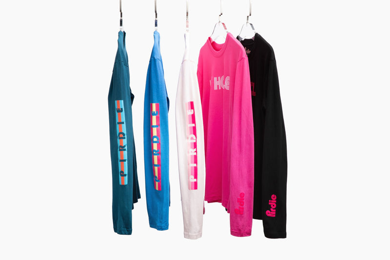 Load image into Gallery viewer, All of Pirdie&#39;s longsleeve golf t-shirts on hangers.
