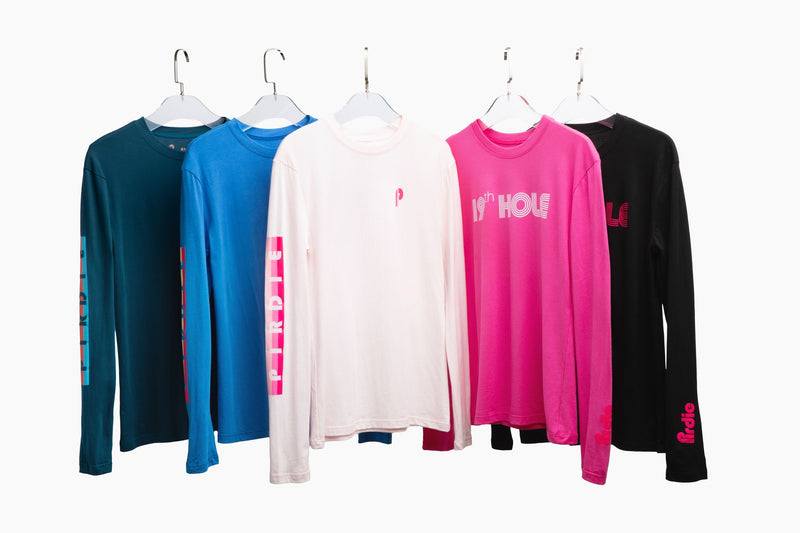 Load image into Gallery viewer, All of Pirdie&#39;s longsleeve golf t-shirts on hangers.
