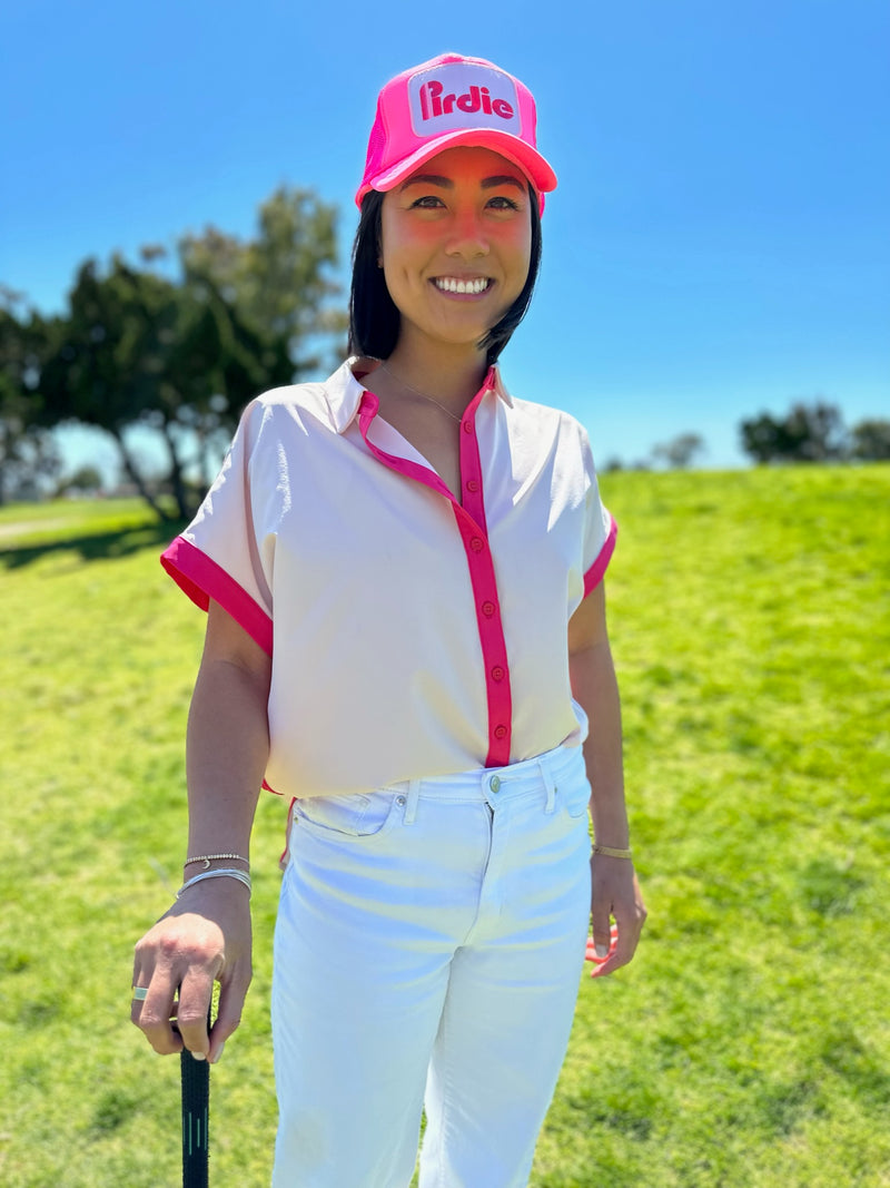 Load image into Gallery viewer, Model wearing Pink Caddy Camp golf shirt with Hot Pink Pirdie golf trucker hat.

