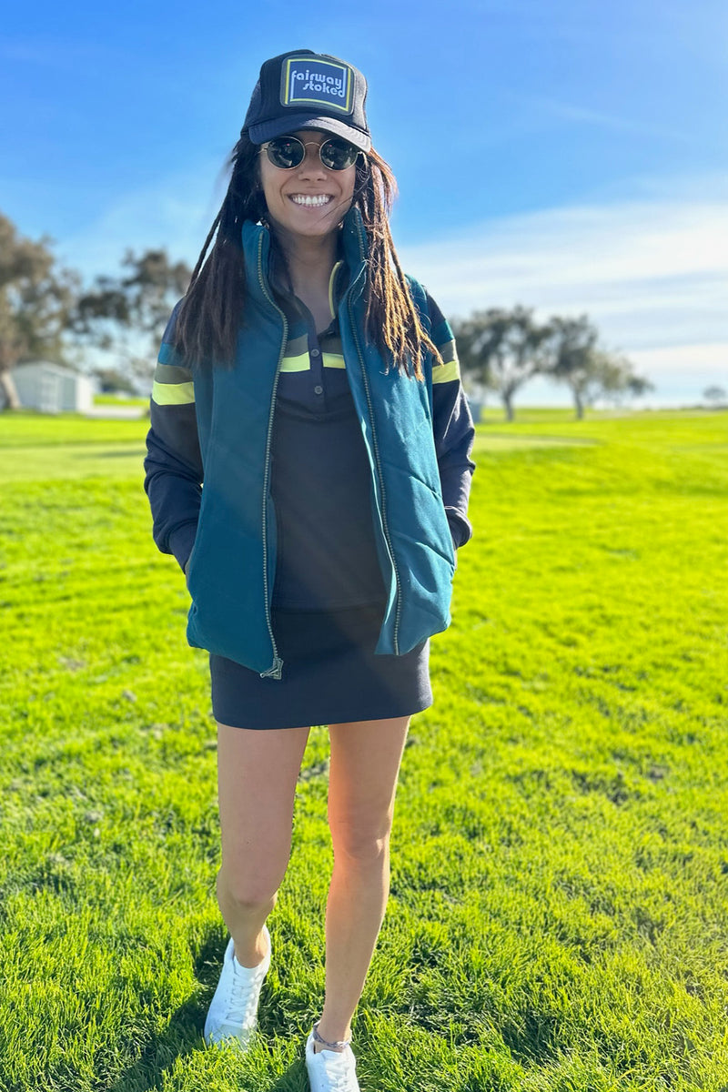 Load image into Gallery viewer, Model wearing Teal twilight womens golf vest and Black Murray womens golf  long sleeve collared shirt
