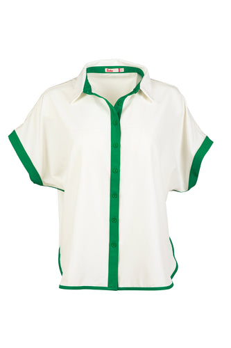 White and green Caddy Camp golf shirt in flat lay studio shot.