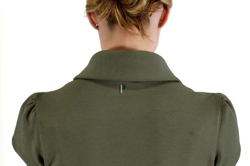 Load image into Gallery viewer, Model wearing June Daly women&#39;s golf shirt in olive showing branding.

