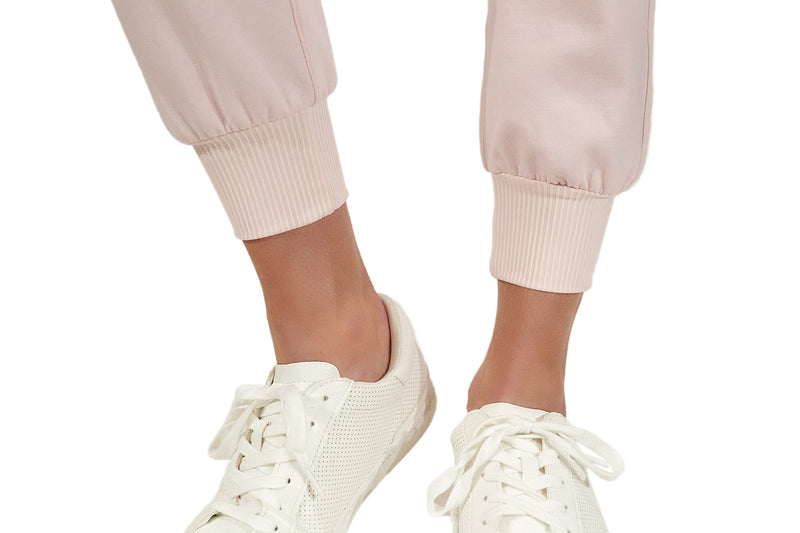 Load image into Gallery viewer, Pink ace jogger ankle cuffs with white tennis shoes. 
