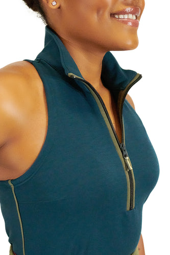 Model wearing Teal Back Nine womens golf sleeveless shirt with black zipper