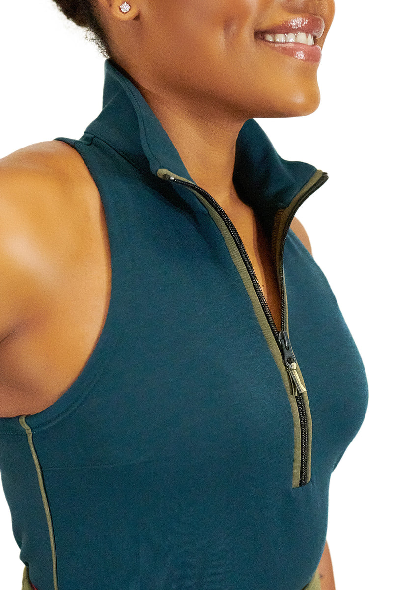 Load image into Gallery viewer, Model wearing Teal Back Nine womens golf sleeveless shirt with black zipper
