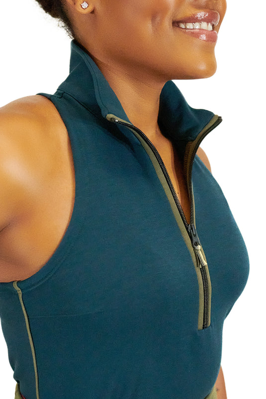 Model wearing Teal Back Nine womens golf sleeveless shirt with black zipper